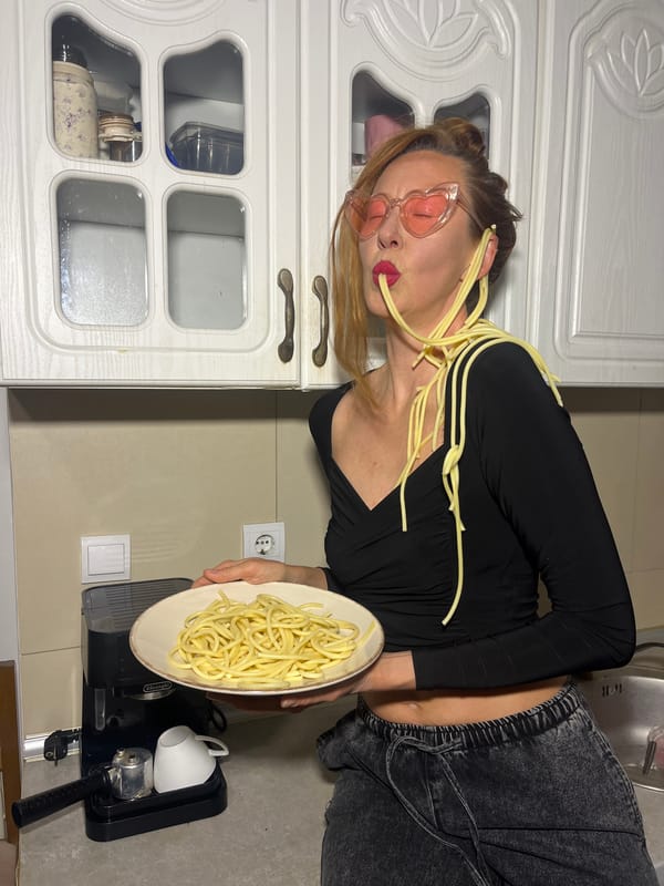 Woman photographs dessert spread in Budva kitchen