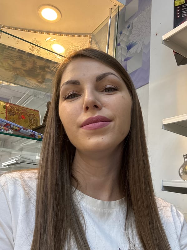 Woman photographed with tulips in Klin store early morning