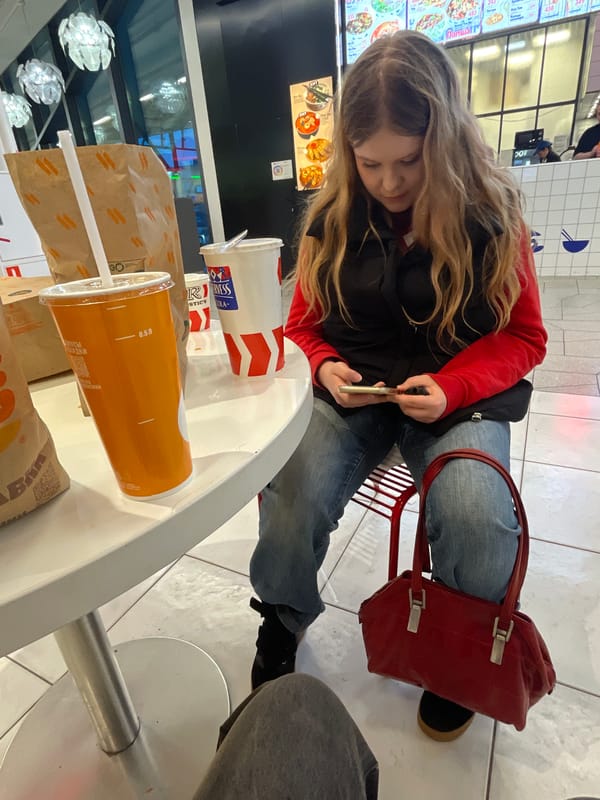 Woman dining with handbag observed in Saint Petersburg