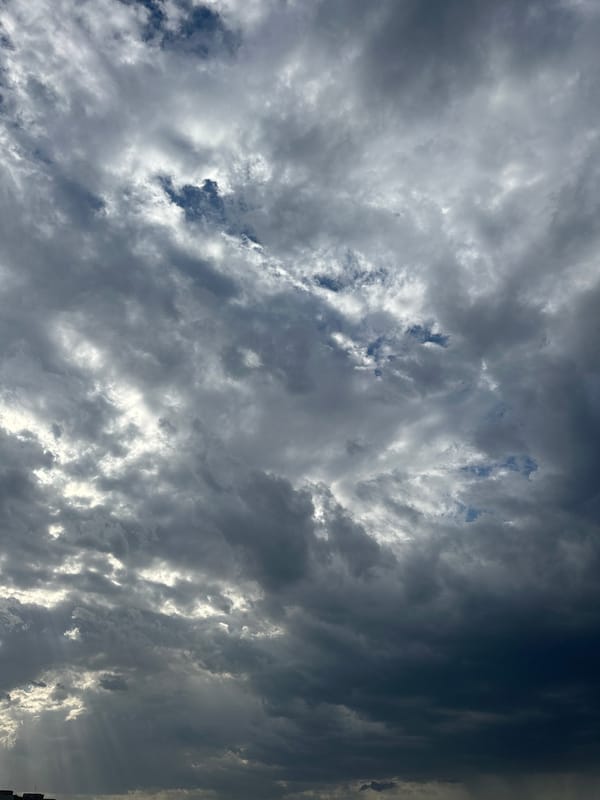 Stormy skies and personal moments documented across unknown city