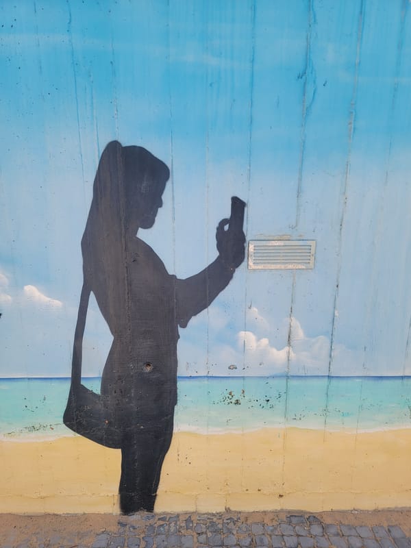 Afternoon stroll through Quarteira's murals, flowers and beach culture