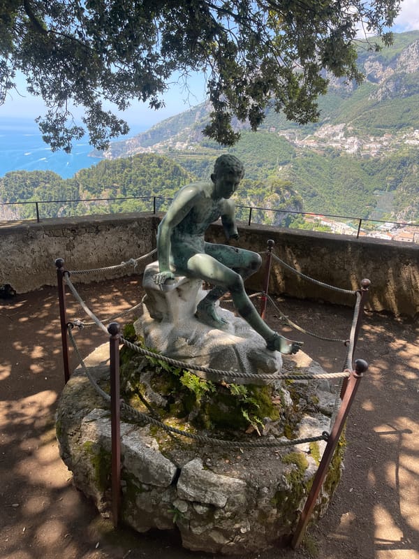 Tourist documents gardens and coastal views in Ravello, Italy