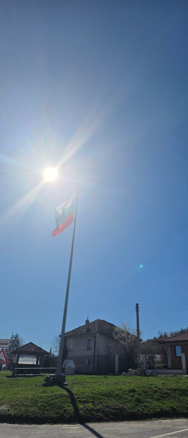 Morning scenes documented in Belchin Bulgaria including flag sculpture
