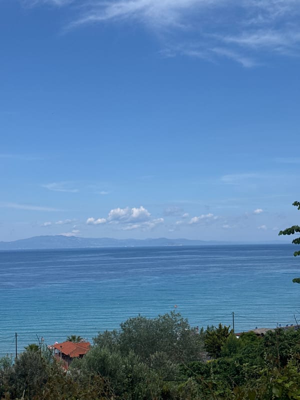 Beach crowds gather in Kassandra with stage setup