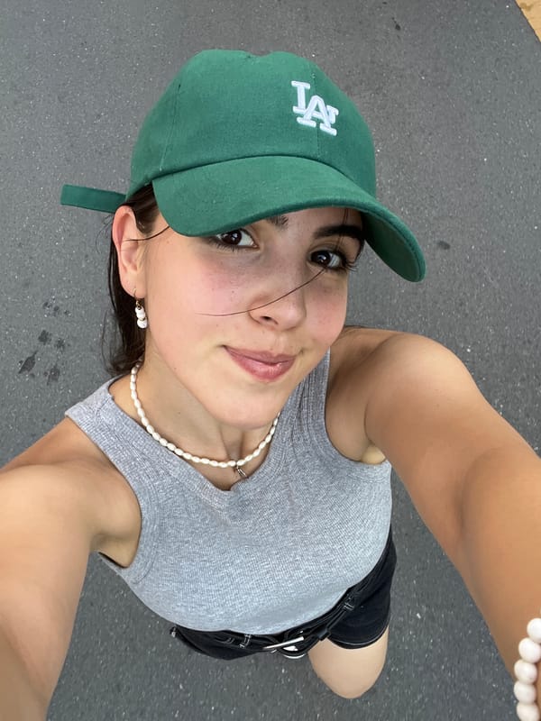 Selfie series on a Daegu street, green LA cap and pearl jewelry