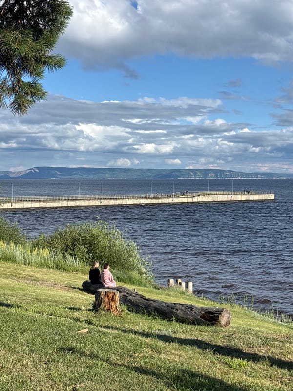 Quiet afternoon along a riverside walkway in Podstepki