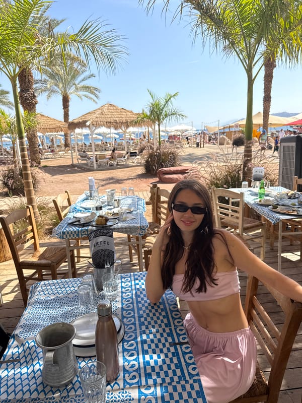 Couple enjoys beachside lunch and beer toast in Eilat