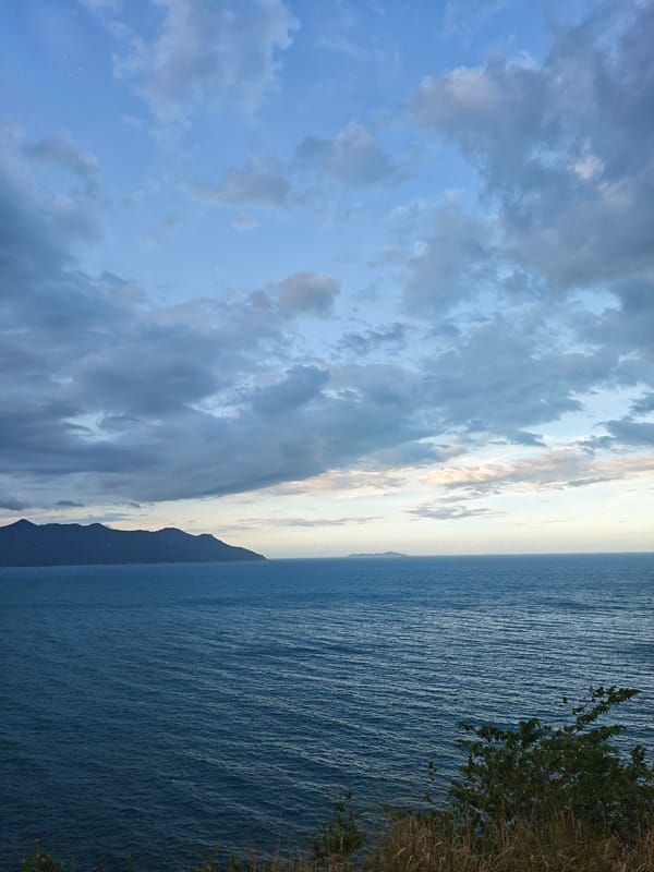 Coastal vista with turquoise waters and islands documented