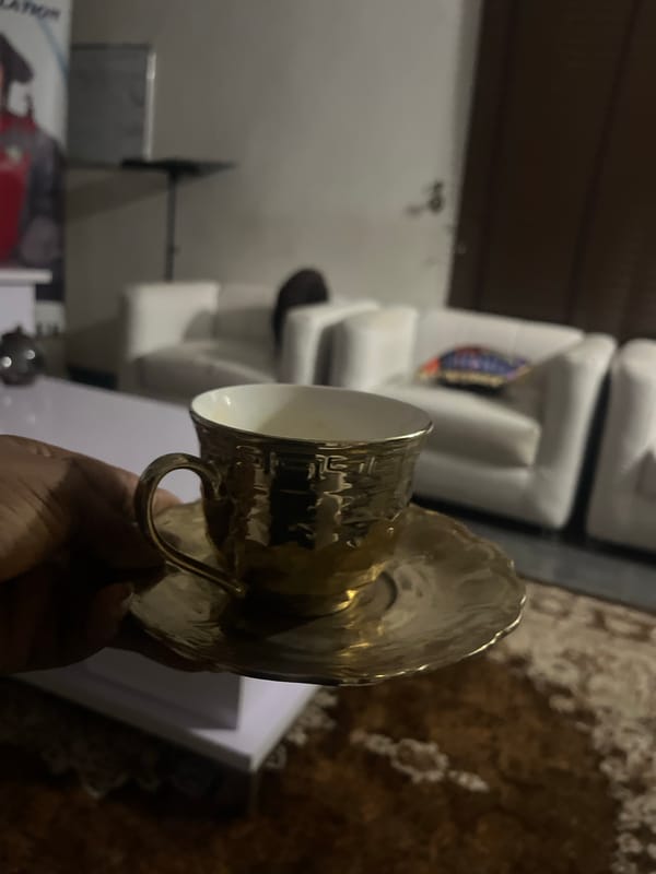 Domestic scene with whiskey, gold teacup documented in Lokoja