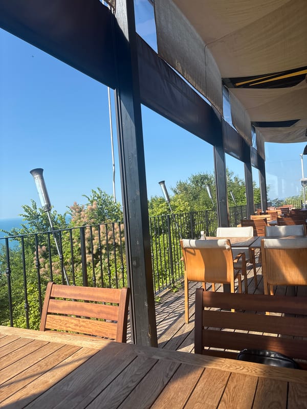 Oceanfront balcony breakfast with coffee and sea views