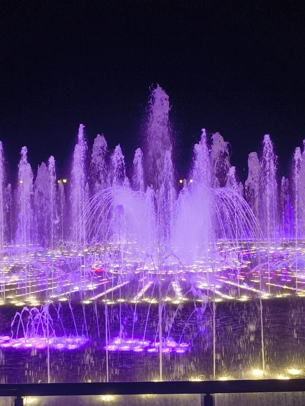 Colorful musical fountain show at VDNKh, Moscow after dark
