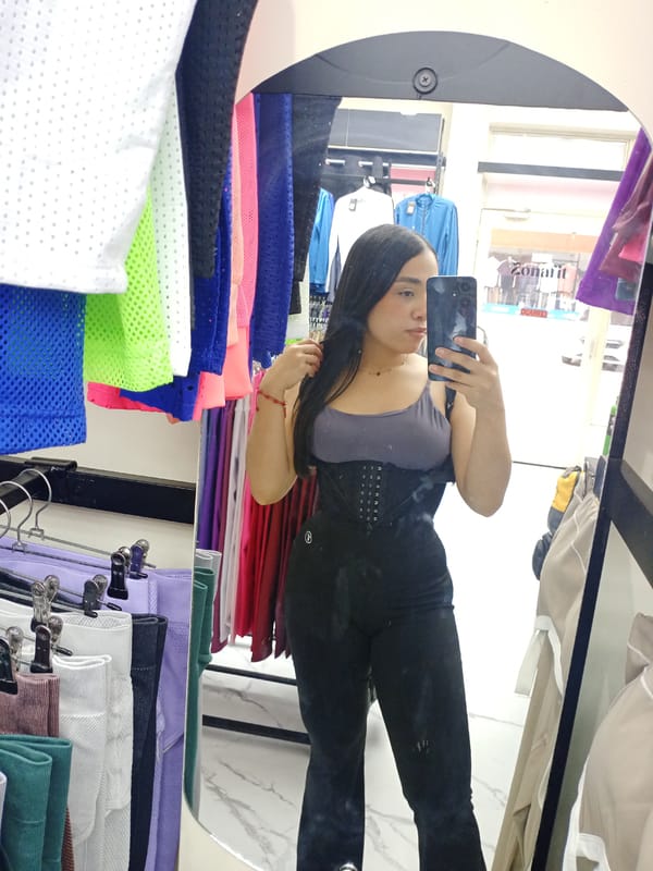 Woman takes selfie in clothing store mirror, Valle de La Pascua