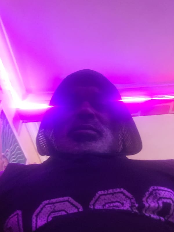 Person in purple-accented hoodie spotted indoors in city location