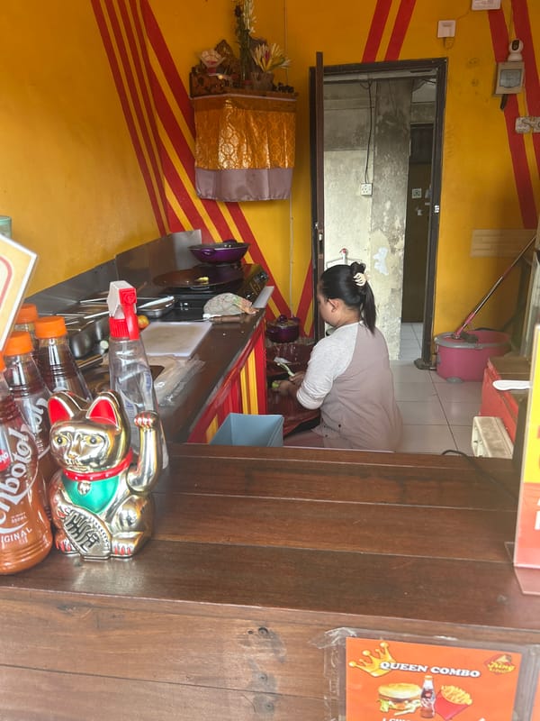 Denpasar street life: textiles, traffic, and a food stall