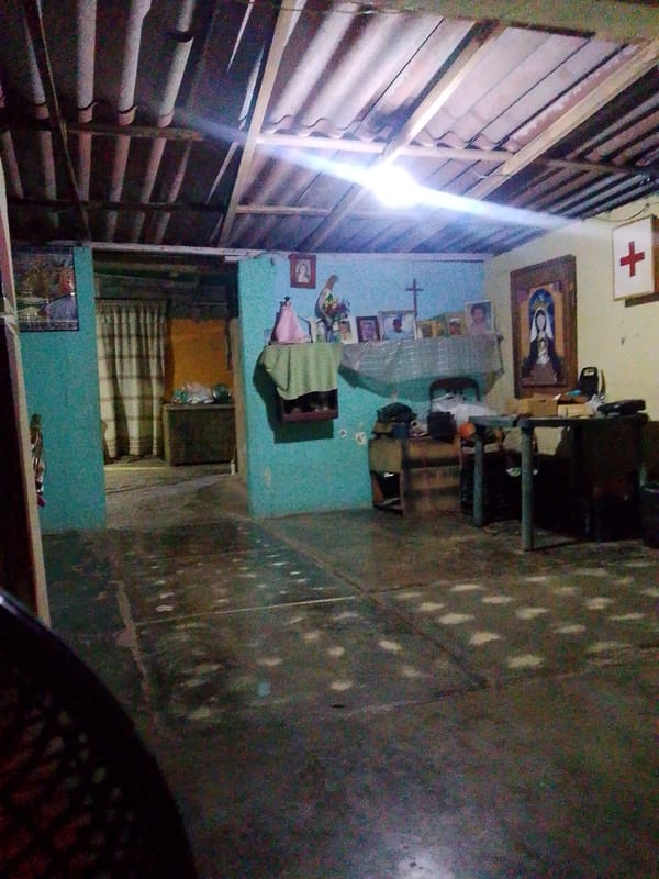 Modest Venezuelan home interior captured with religious decorations