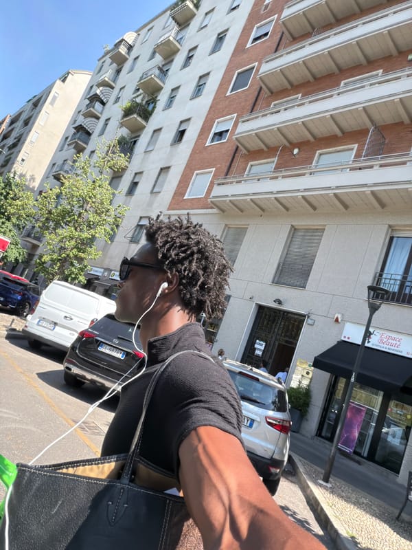 On foot and on scooter through the same Milan street