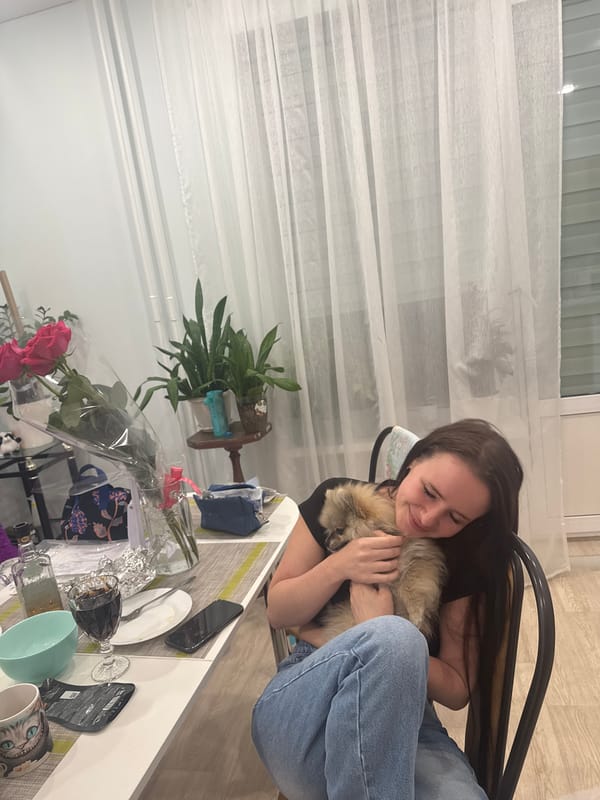 Woman plays with Pomeranian and Chihuahua at Sertolovo home