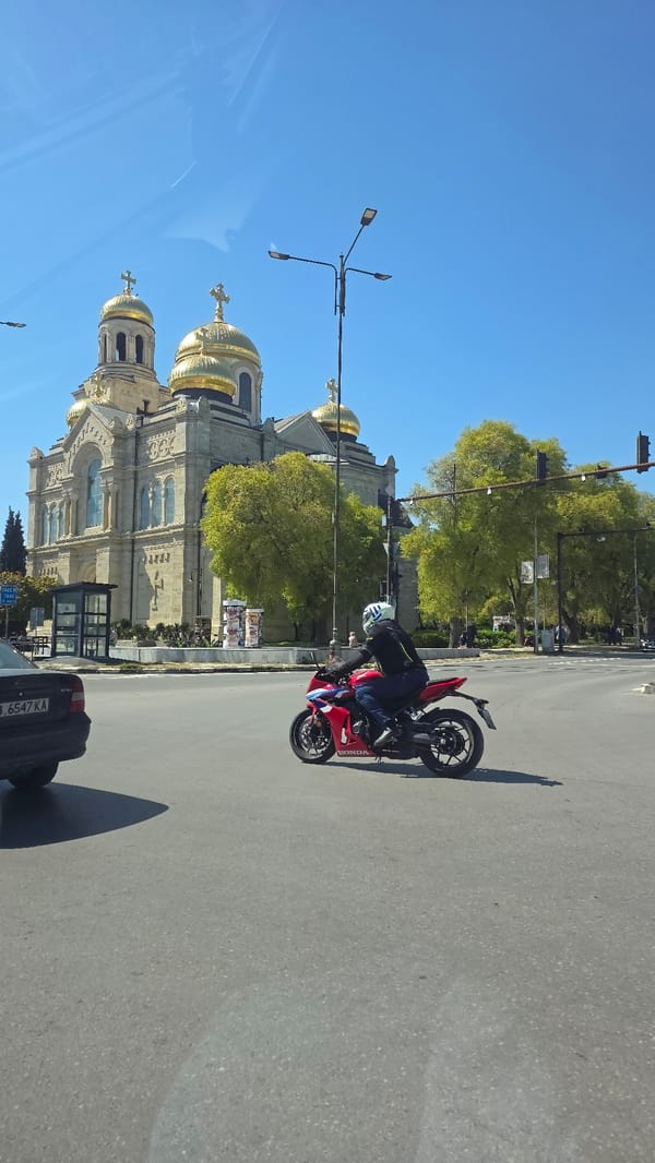 Everyday street life continues around Varna cathedral