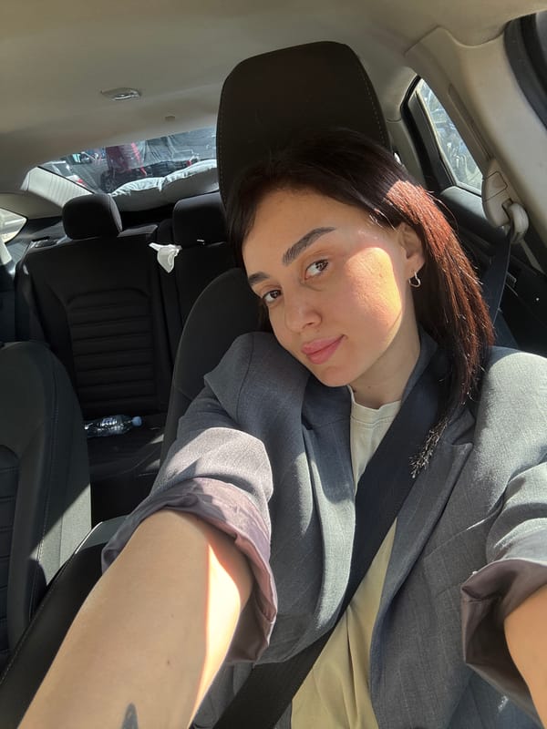 Woman takes selfie in car in Tbilisi