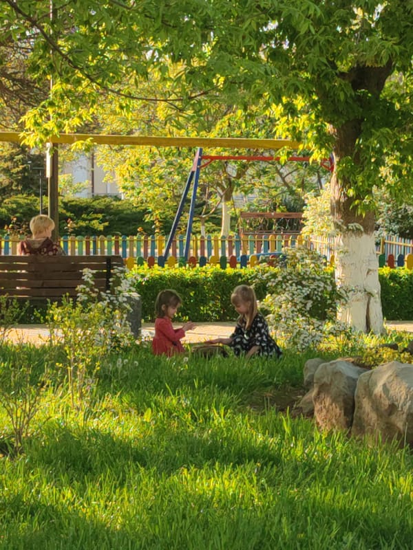 Children play near Cossack monument in Sennoy park