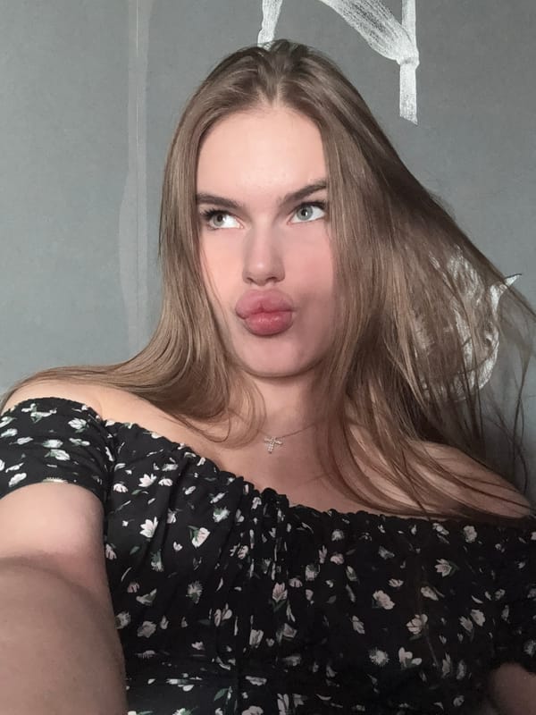 Quick selfie session in a Dnipro apartment, black floral dress