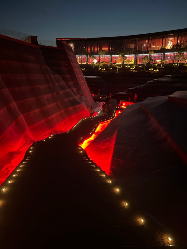 Evening crowds gather at illuminated entertainment complex in Krasnodar