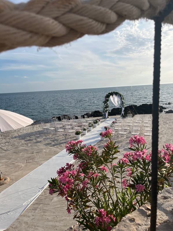 Beachfront wedding ceremony held at sunset in Kunje, Montenegro