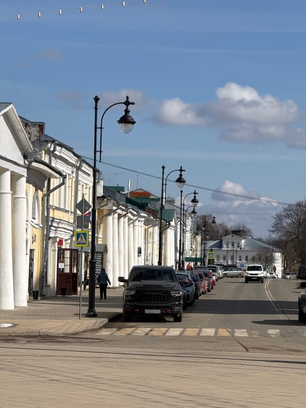 Urban street scenes documented showing mixed architecture, signage