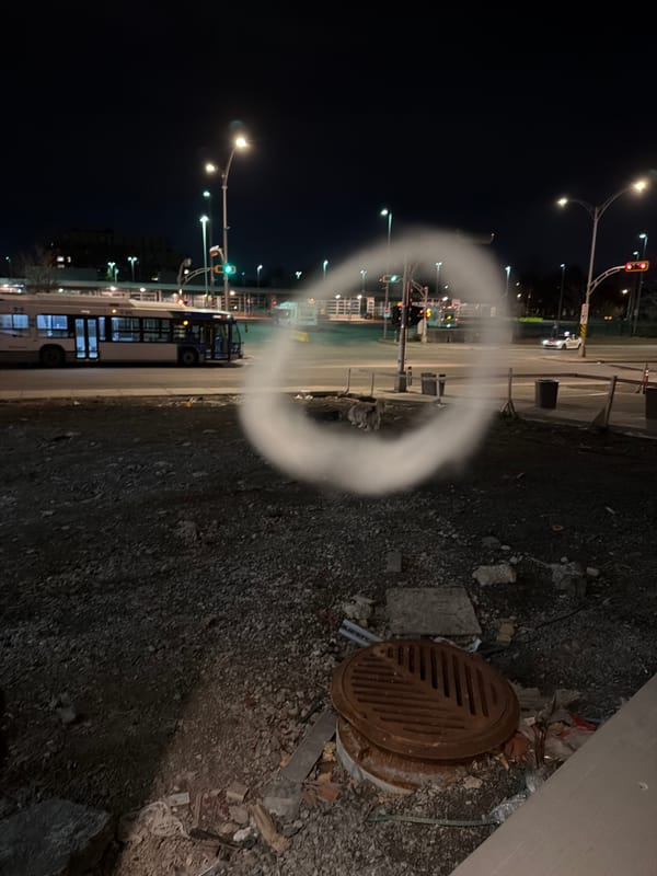 Transit bus stops at traffic light in Laval