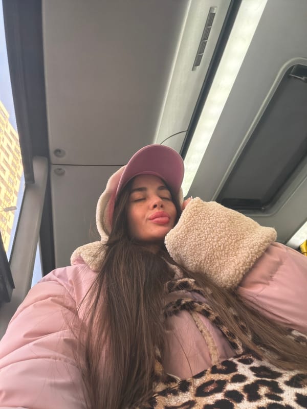 Woman in pink rides public bus in Saint Petersburg