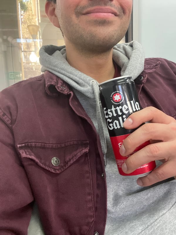 Person enjoys Estrella Galicia beer in Caldes d'Estrac