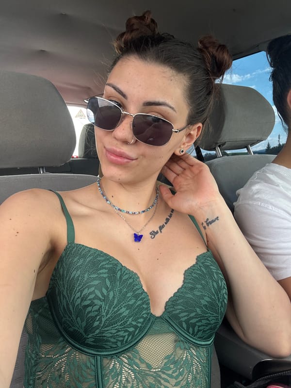 Woman poses for photos inside car in Gorna Malina