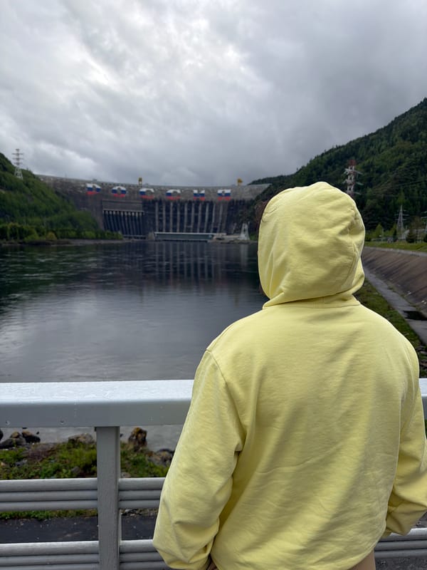 Visitor observes Sayano-Shushenskaya Dam from multiple viewpoints in Russia