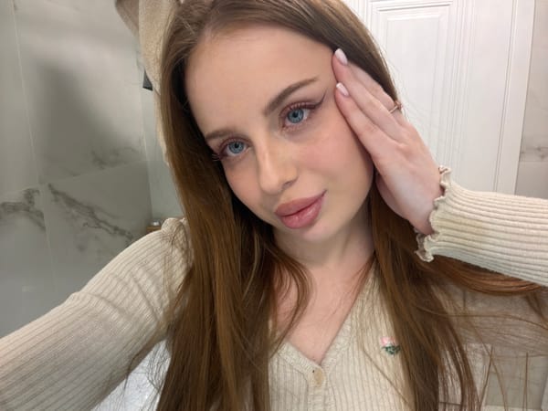 Woman takes multiple selfies indoors in Saint Petersburg