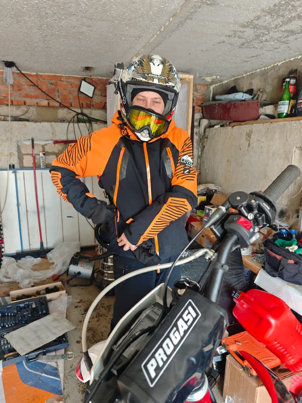 Muddy dirt bike session documented in Russian residential area