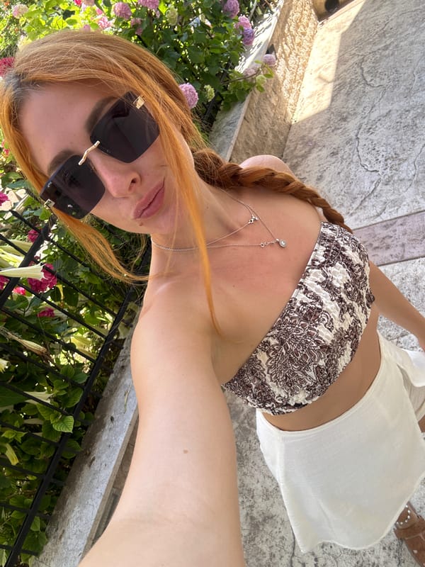 Woman documents morning photo session in Budva Montenegro streets