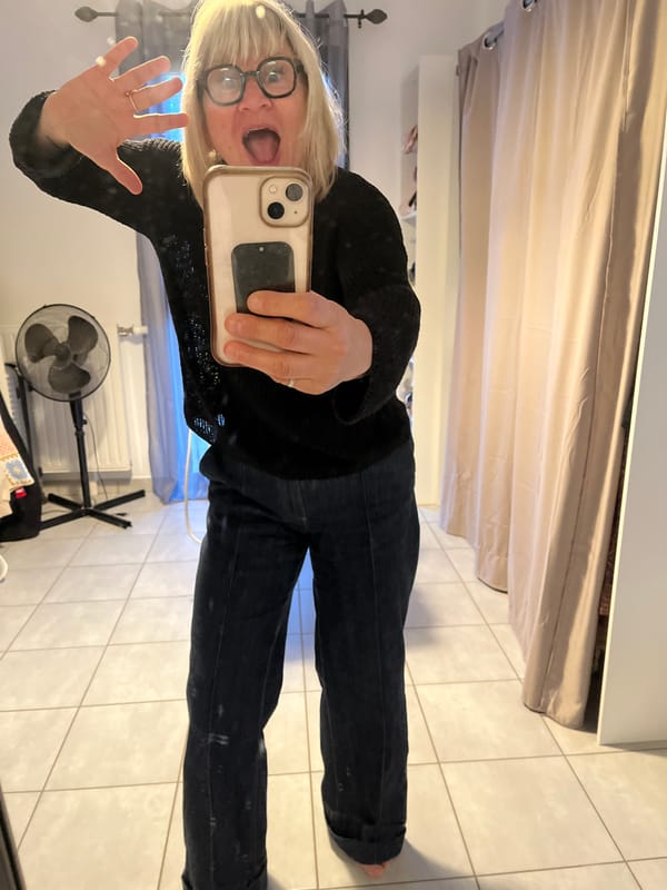 Woman takes mirror selfies in Chambœuf, France early morning