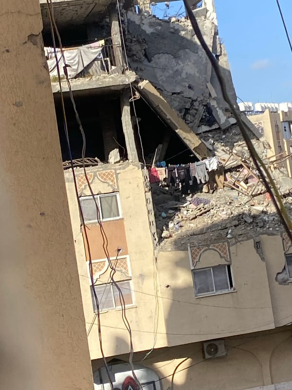 Widespread building damage documented in Khan Yunis, children collecting water
