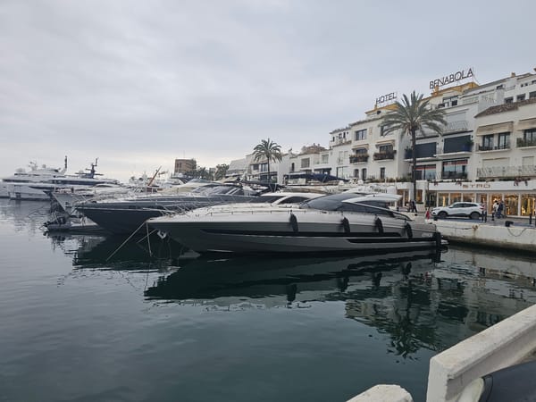 Afternoon scenes from Marbella marina district under overcast skies