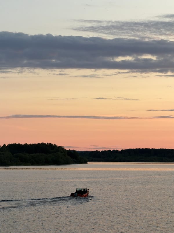 Sunset on the water in Solikamsk, boat and deck views
