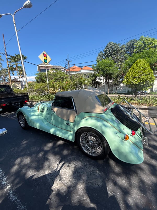 Vintage green convertible spotted parked in Denpasar street