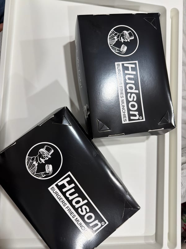 Hudson Burgers food boxes spotted on white tray