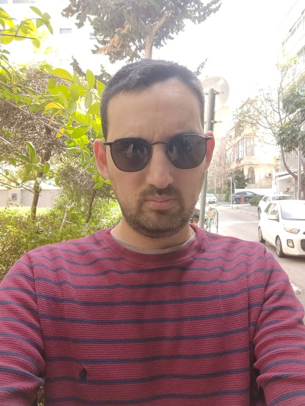 Man takes selfie on Tel Aviv sidewalk