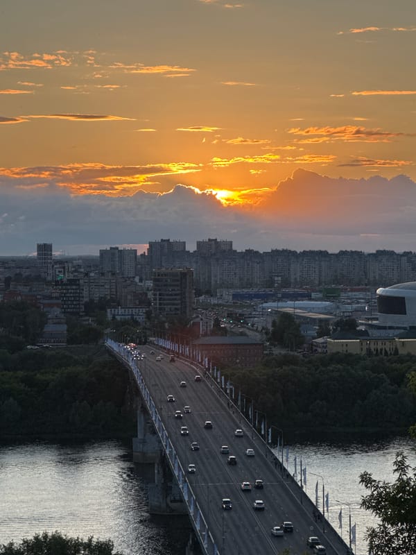 Sunset over Nizhny Novgorod, with riverfront scenes and street life