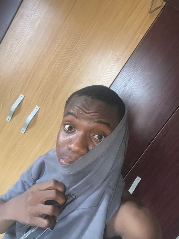 Young man in gray hoodie observed in Minna