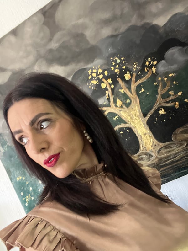 Woman photographed with dog, near artwork in Konz