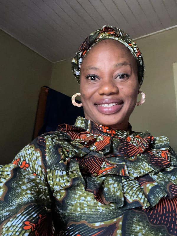 Woman in traditional dress spotted smiling in Narayi