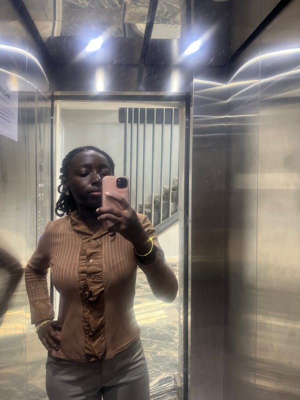 Woman Takes Selfies in Elevator with Illuminated Portraits in Karum
