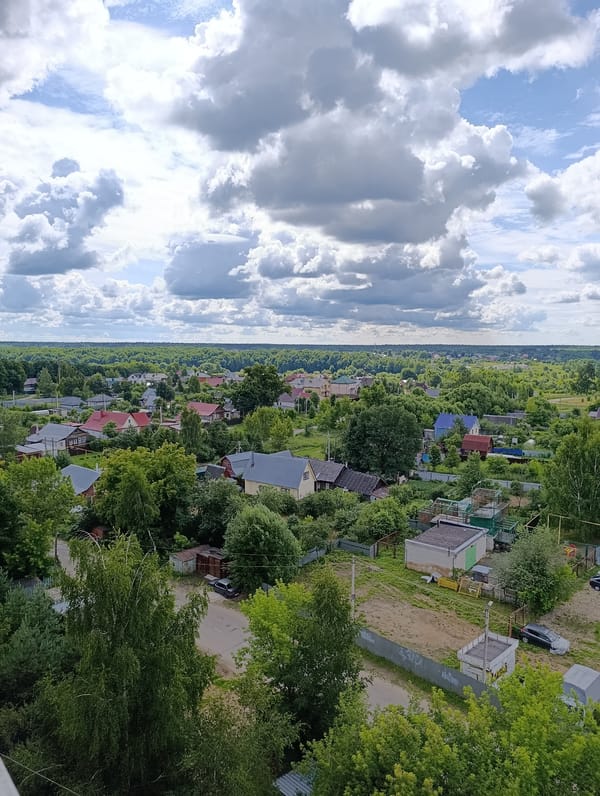 Stormy morning over Alexandrov's rooftops, forests, and home life