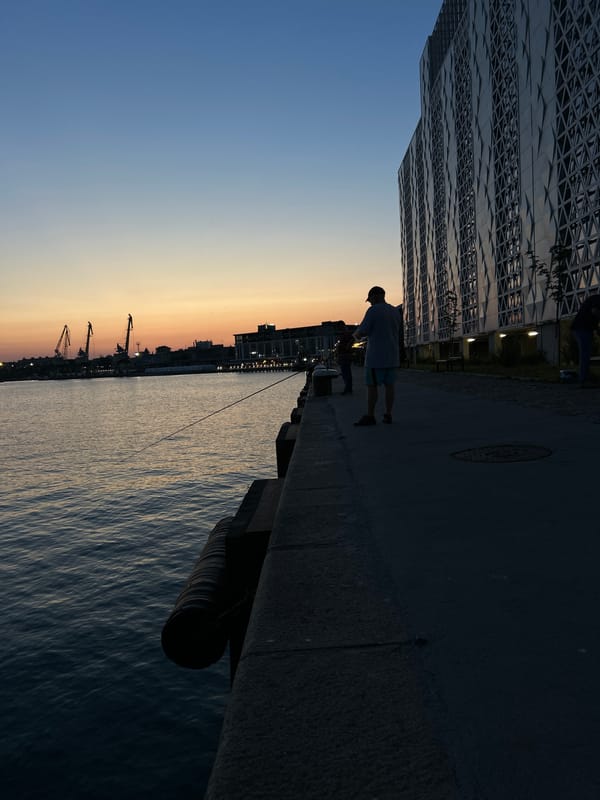 Burgas port and waterfront at dusk, tugboats and twilight